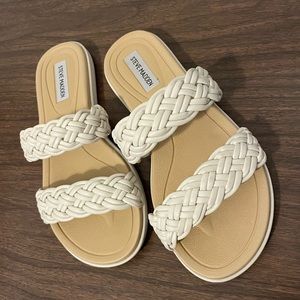 Woman’s size 7.5 Steve Madden slide flat sandal. Off-white with nude sole.